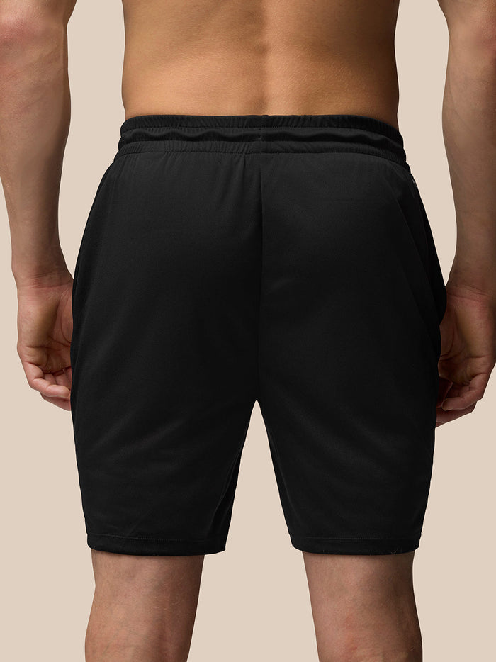 Rear view close-up of black Adapt Training Shorts focusing on the elasticated waistband