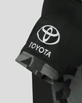 Close-up of the sleeve on a black Manchester Originals replica shirt showing the Toyota logo