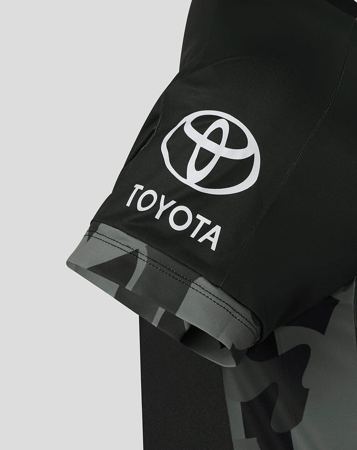 Close-up of the sleeve on a black Manchester Originals replica shirt showing the Toyota logo