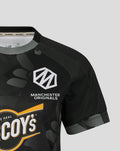 Front view of a black camo Manchester Originals shirt showing the crest and The Real McCoy's logo.