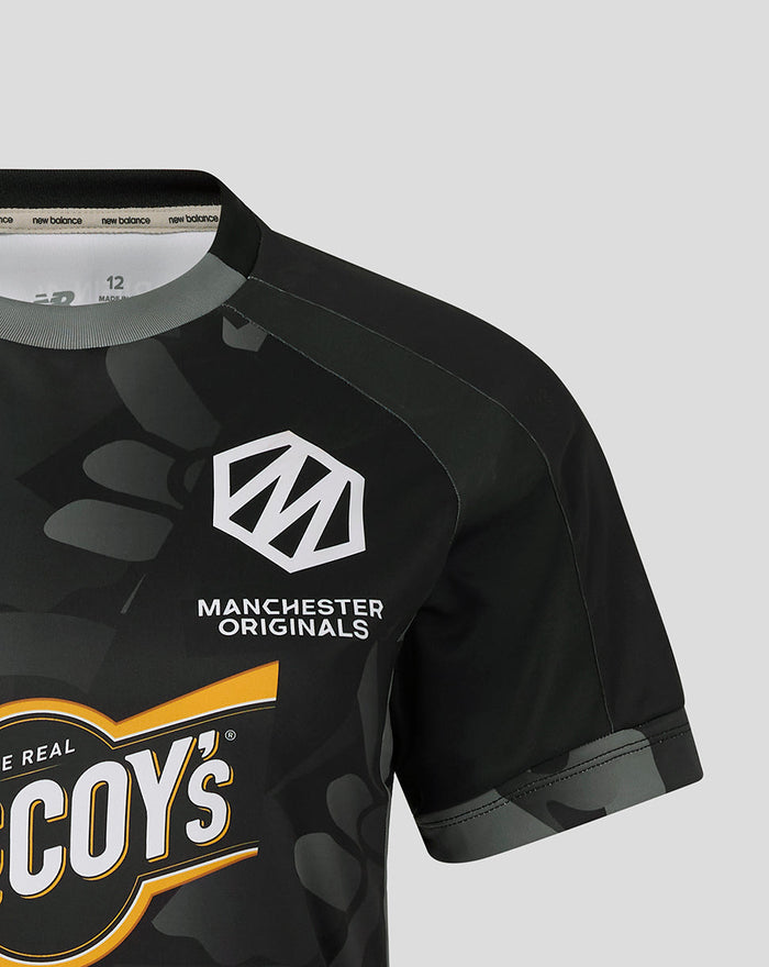 Front view of a black camo Manchester Originals shirt showing the crest and The Real McCoy's logo.