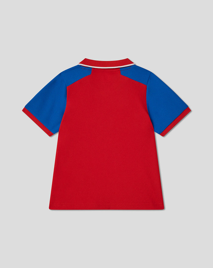 Back view of infant red T20 cricket shirt with blue sleeves