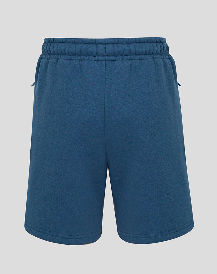 Back view of Junior travel fleece shorts in ensign blue with elastic waistband and drawstring