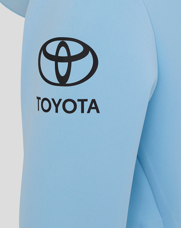 Light blue hoodie sleeve with a large black Toyota logo