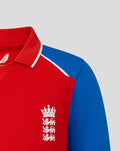 Close up of red junior T20 shirt with blue shoulder panel white collar trim and England crest on the chest.