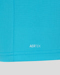 Close up of bright blue fabric near the hem showing AERTEK branding.
