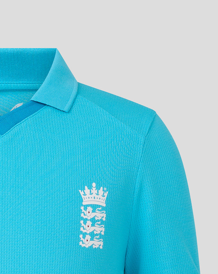 Front close up of blue Junior ODI short sleeve shirt with England cricket crest on the chest.