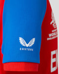 Blue sleeve close up with white Castore wing logo on the red junior shirt