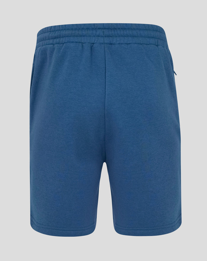 Back view of Ensign Blue fleece shorts with elastic waistband and a zip pocket