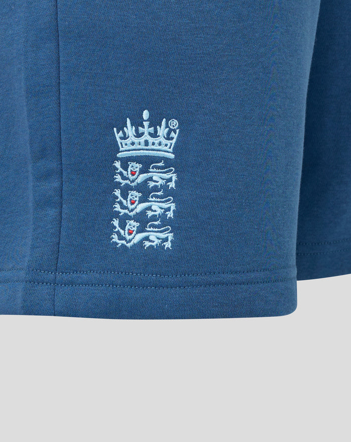 Close up of Ensign Blue fleece fabric with the Navy Three Lions crest embroidery on shorts