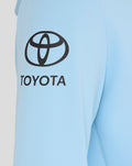 Close-up of light blue hoodie sleeve with Toyota logo.
