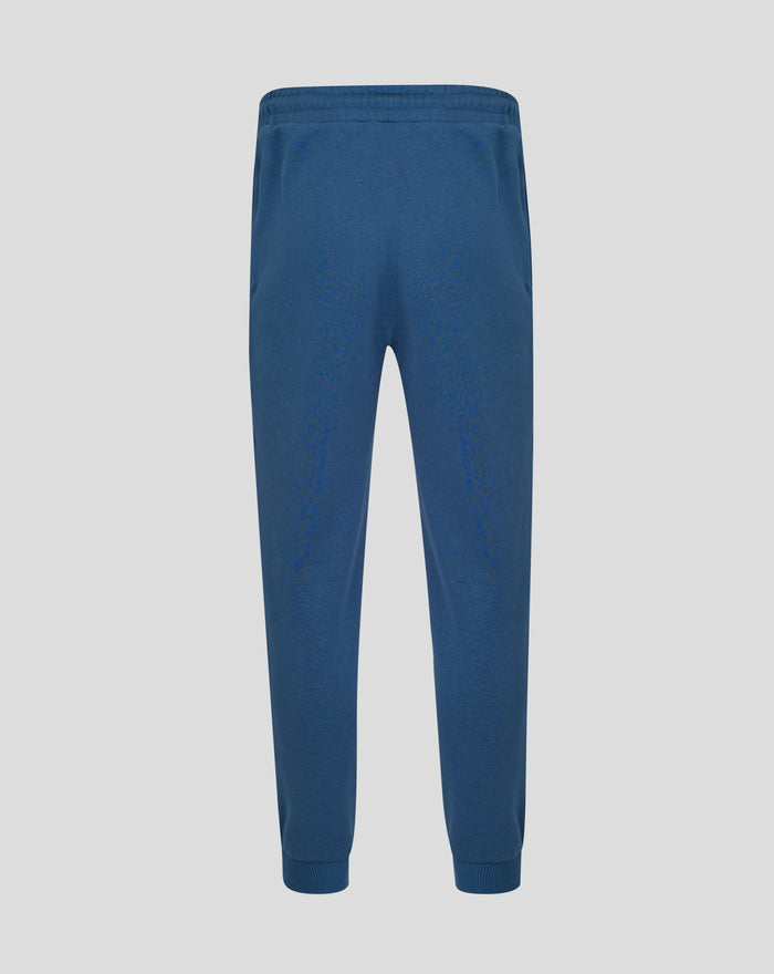 Back view of ensign blue Travel Adapt fleece joggers with a small crest on the left leg