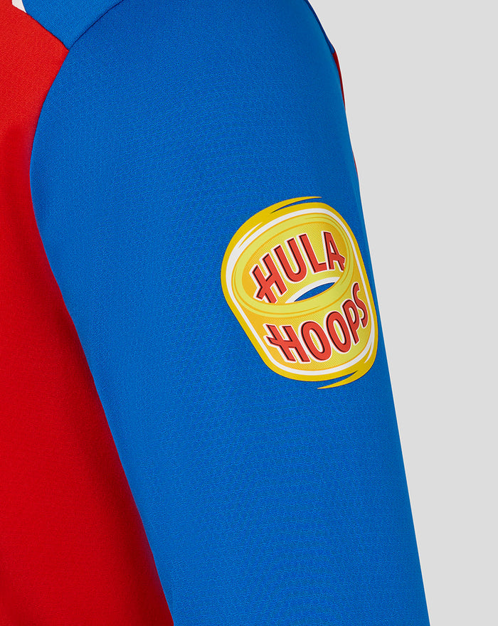 Blue sleeve featuring a yellow circular HULA HOOPS patch on the arm