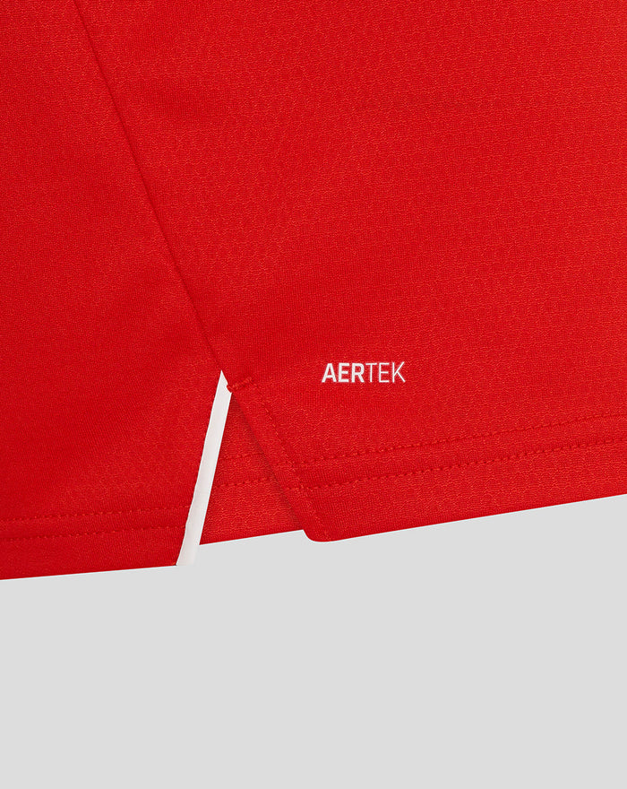 Close up of red T20 Pro long sleeve shirt fabric with AERTEK logo near the hem