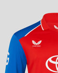 Red T20 Pro long sleeve cricket shirt with blue shoulder panel and Castore branding on chest.