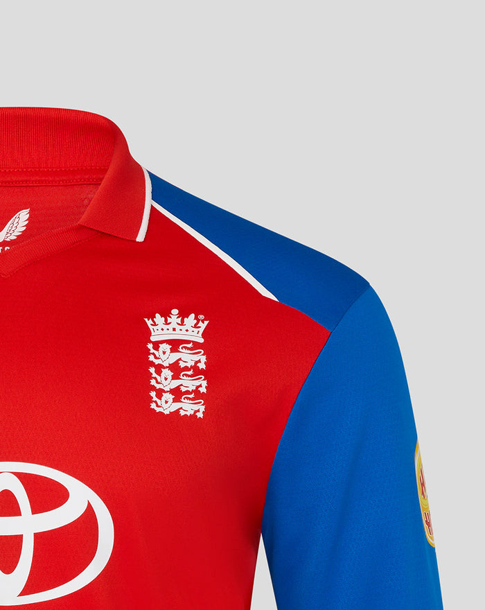 Red England cricket shirt with white crest on chest and blue sleeve panel.