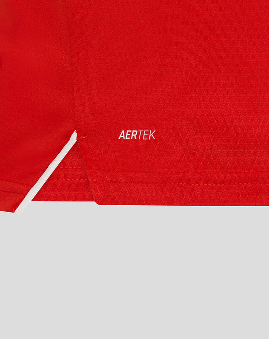 Close-up of red fabric featuring the AERTEK branding on the T20 Pro shirt.