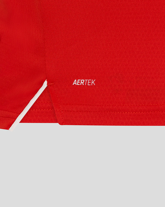 Close-up of red fabric featuring the AERTEK branding on the T20 Pro shirt.