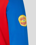 Red and blue T20 sweater sleeve featuring a Hula Hoops logo patch on the blue panel