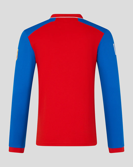 Back view of men's red and blue T20 long sleeve cricket shirt showing blue sleeves against a red torso