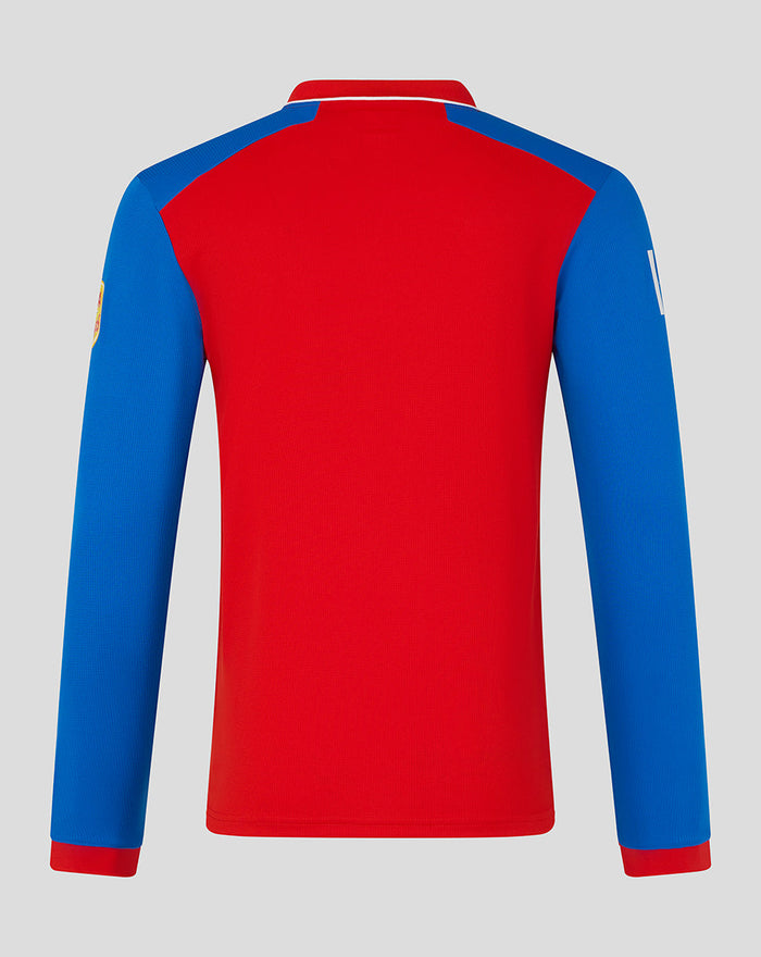 Back view of men's red and blue T20 long sleeve cricket shirt showing blue sleeves against a red torso