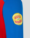 Blue sleeve features a yellow circular Hula Hoops patch on the red and blue T20 shirt