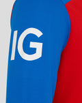 Close-up of blue sleeve with large white lettering on a red and blue T20 cricket shirt