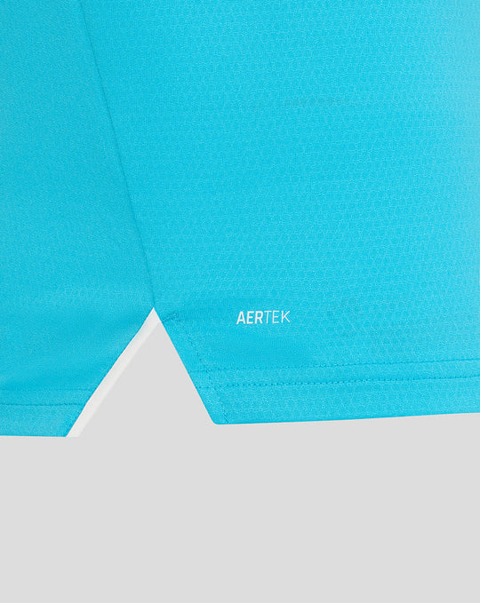 Close-up of the blue ODI Pro long sleeve shirt hem showing AERTEK branding.