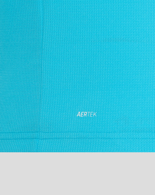 Close up of blue ODI shirt fabric with AERTEK branding at the hem