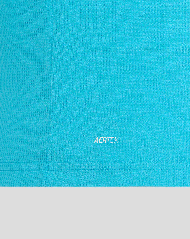 Close up of blue ODI shirt fabric with AERTEK branding at the hem