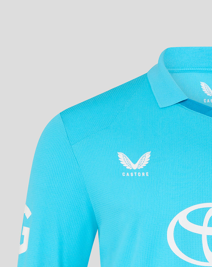 Close up of blue ODI shirt chest showing the Three Lions crest and CASTORE branding near the collar.