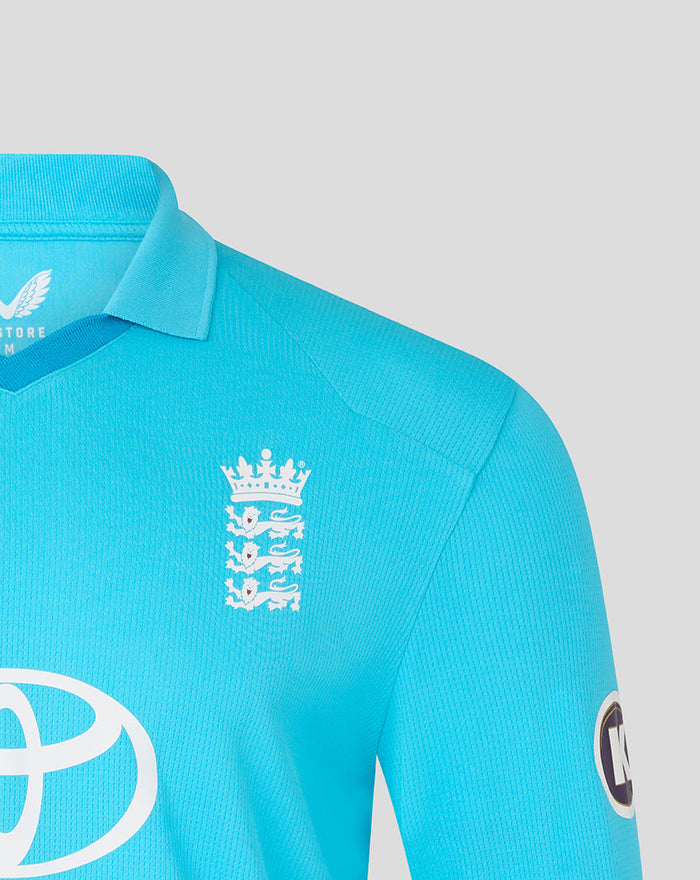 Shoulder and chest view of blue ODI shirt with the Three Lions crest on the chest and a circular sponsor patch on the sleeve.
