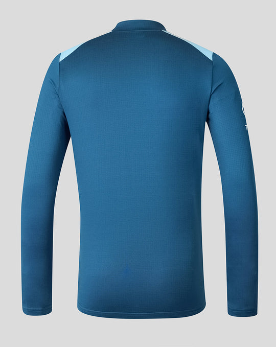 Back view of blue training midlayer top with dual tone shoulder panels.