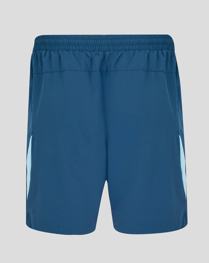 Back view of blue training shorts with a wide elastic waistband and light blue side panels