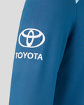 Blue training sweatshirt close-up with a large white Toyota logo on the front.