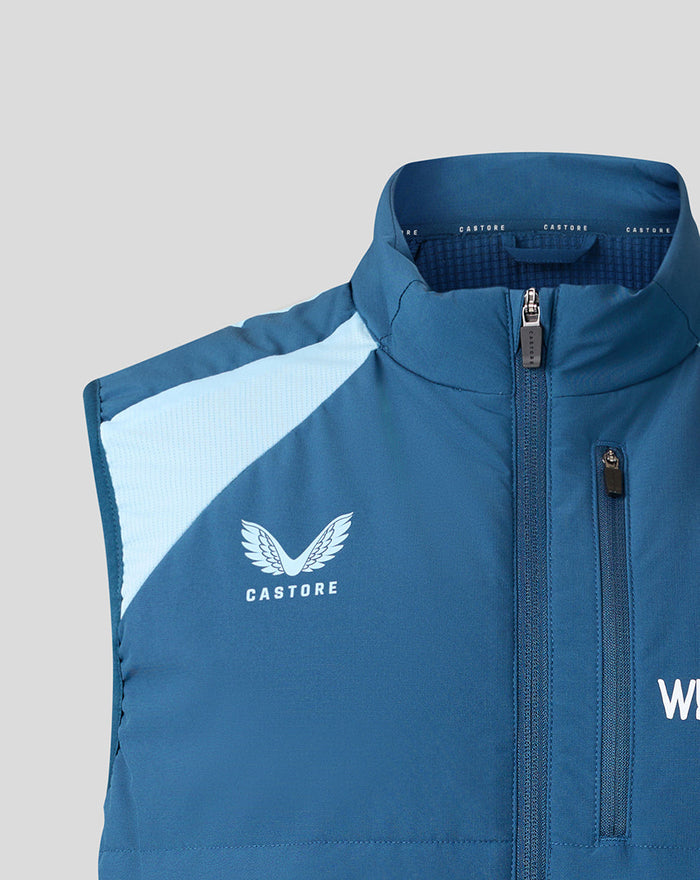 Close up of front chest on blue gilet showing Castore logo and zipper pull