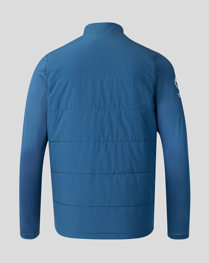Back view of blue insulated training jacket with horizontal quilted panels and high collar