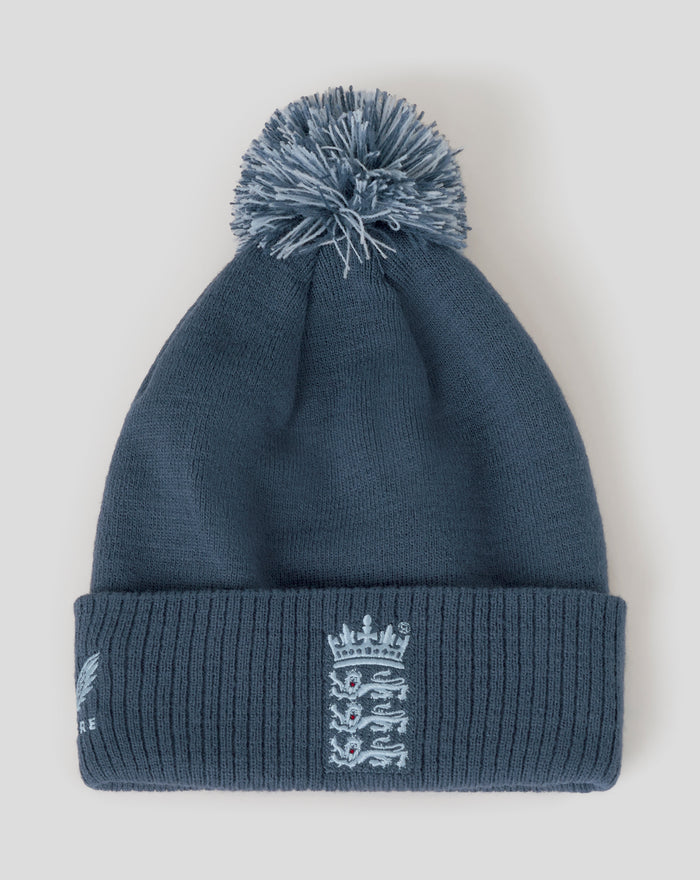 Blue bobble hat with fluffy pom-pom and embroidered Three Lions crest on the cuff