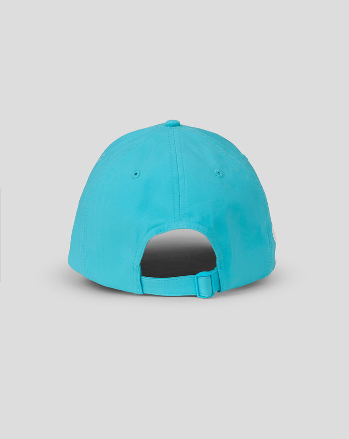 Rear view of turquoise ODI cap showing adjustable strap and back opening