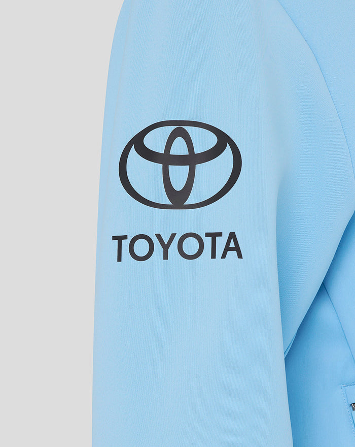 Close up of a light blue Travel Flex hoodie sleeve with the Toyota logo