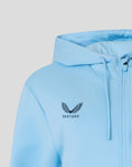 Close up of light blue hoodie chest featuring the Castore wings crest and branding
