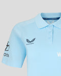 Close up of a light blue travel polo showing a structured collar and navy Three Lions crest