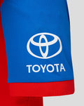 Blue sleeve with the white Toyota emblem on the shirt