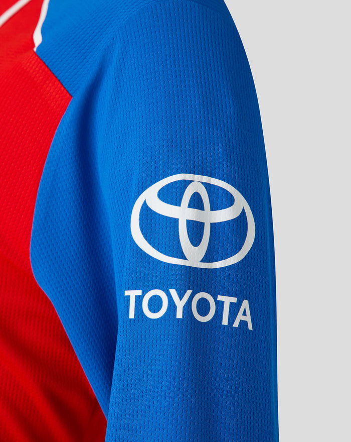Blue sleeve close up showing the Toyota logo and TOYOTA wordmark on the shirt