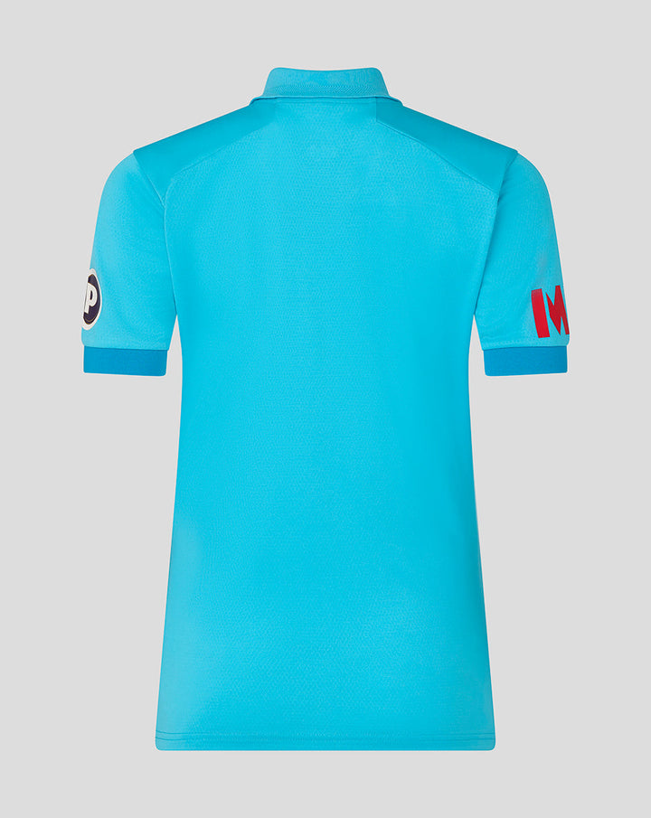 Back view of vibrant blue ODI Pro short sleeve cricket shirt with a textured fabric and polo style collar