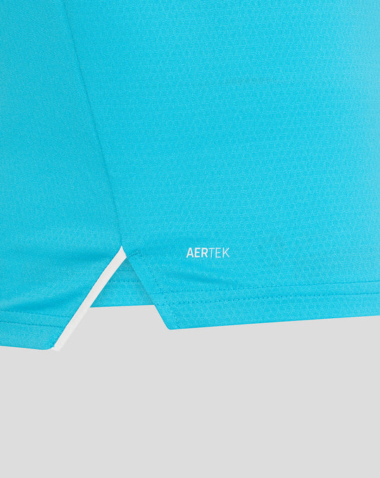 Close-up of bright blue fabric showing AERTEK branding near the hem