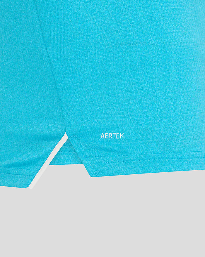Close-up of bright blue fabric showing AERTEK branding near the hem