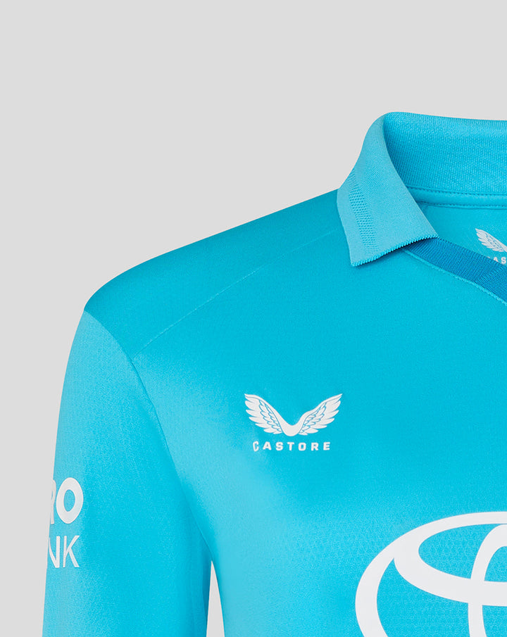 Close up of blue ODI Pro shirt collar and chest showing the Castore logo.