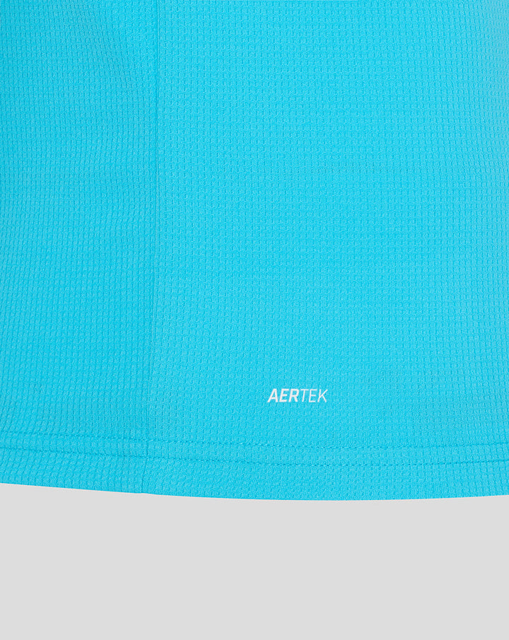 Close up of bright blue ODI replica shirt fabric with AERTEK branding at the hem