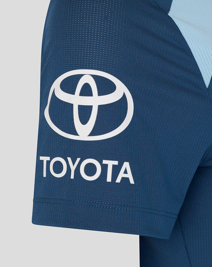 Close-up of sleeve showing Toyota logo on a navy training T-shirt